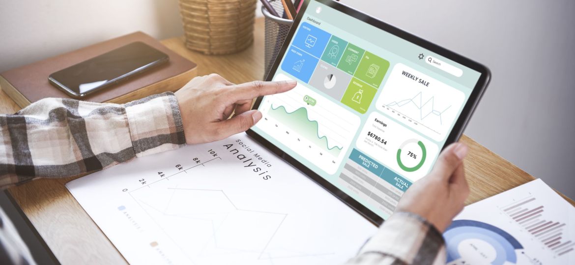 Businesswoman using a tablet to analysis graph company finance s