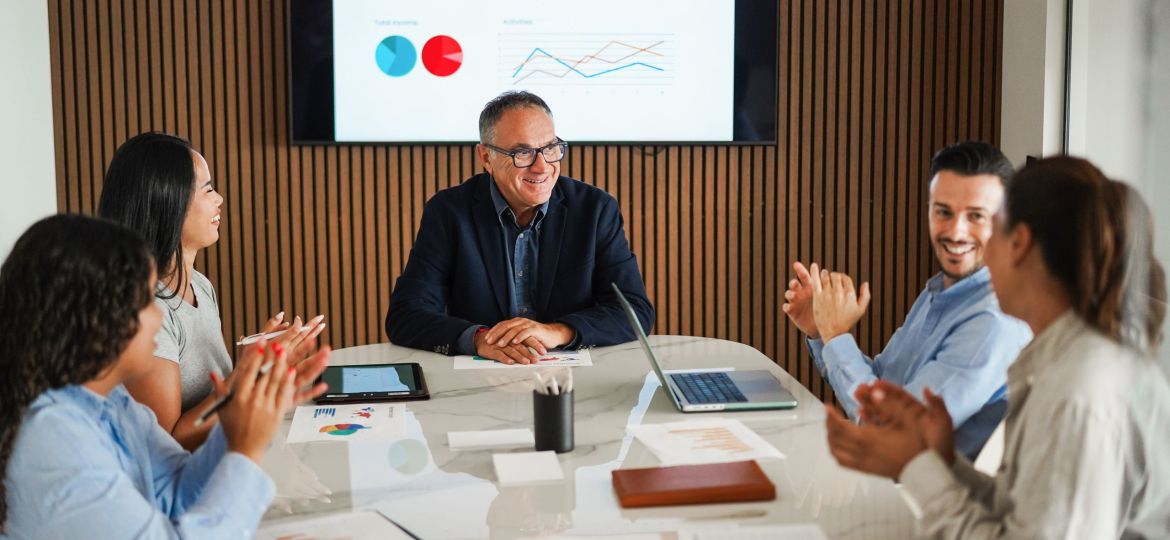 Multiracial colleagues working inside business office with glass
