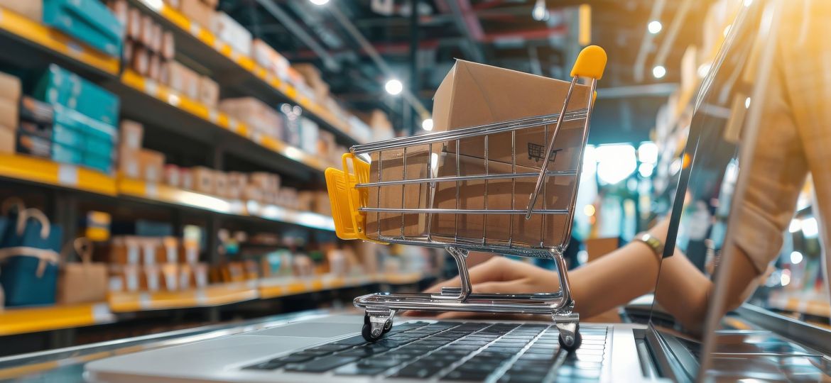 Person setting up an online store, uploading products on a laptop